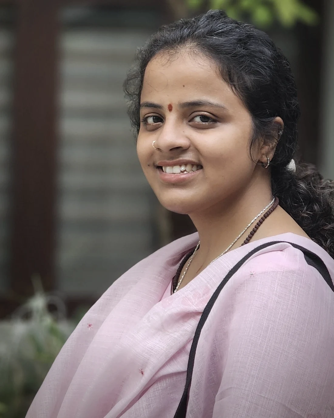 Portrait of Dr. Sasi Vadana, physician and meditator, part of the Trikonam community.